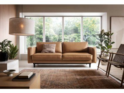 Rozkladacia pohovka do obývačky LUXERA SOFA v hnedom čalúnení v modernom interiéri obývačky