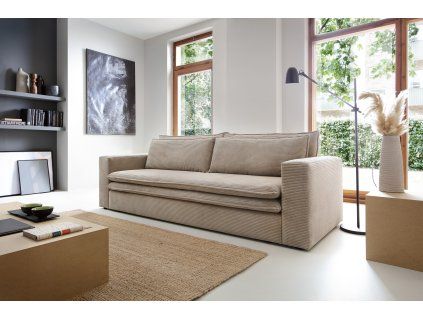 Rozkladacia pohovka ALBER SOFA v interiéri pri okne, béžové čalúnenie, pohľad v uhle spredu.