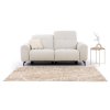 Dvojmiestna pohovka VELVETO SOFA S2 v minimalistickej obývačke so svetlým kobercom.