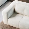 Sedacia súprava CORDIA sofa v látke Monte 03, detail širokej zaoblenej podrúčky, sedacej časti a mäkkého chrbtového vankúša.