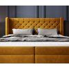 Boxspring posteľ NOLAN, pohľad spredu na prešívané čelo a predný rám.