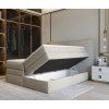 Boxspring posteľ HERMES v spálni so zdvihnutou ložnou plochou a otvoreným úložným priestorom.