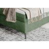 Boxspring posteľ - detail rohu a nohy - zelené čalúnenie a kovová noha